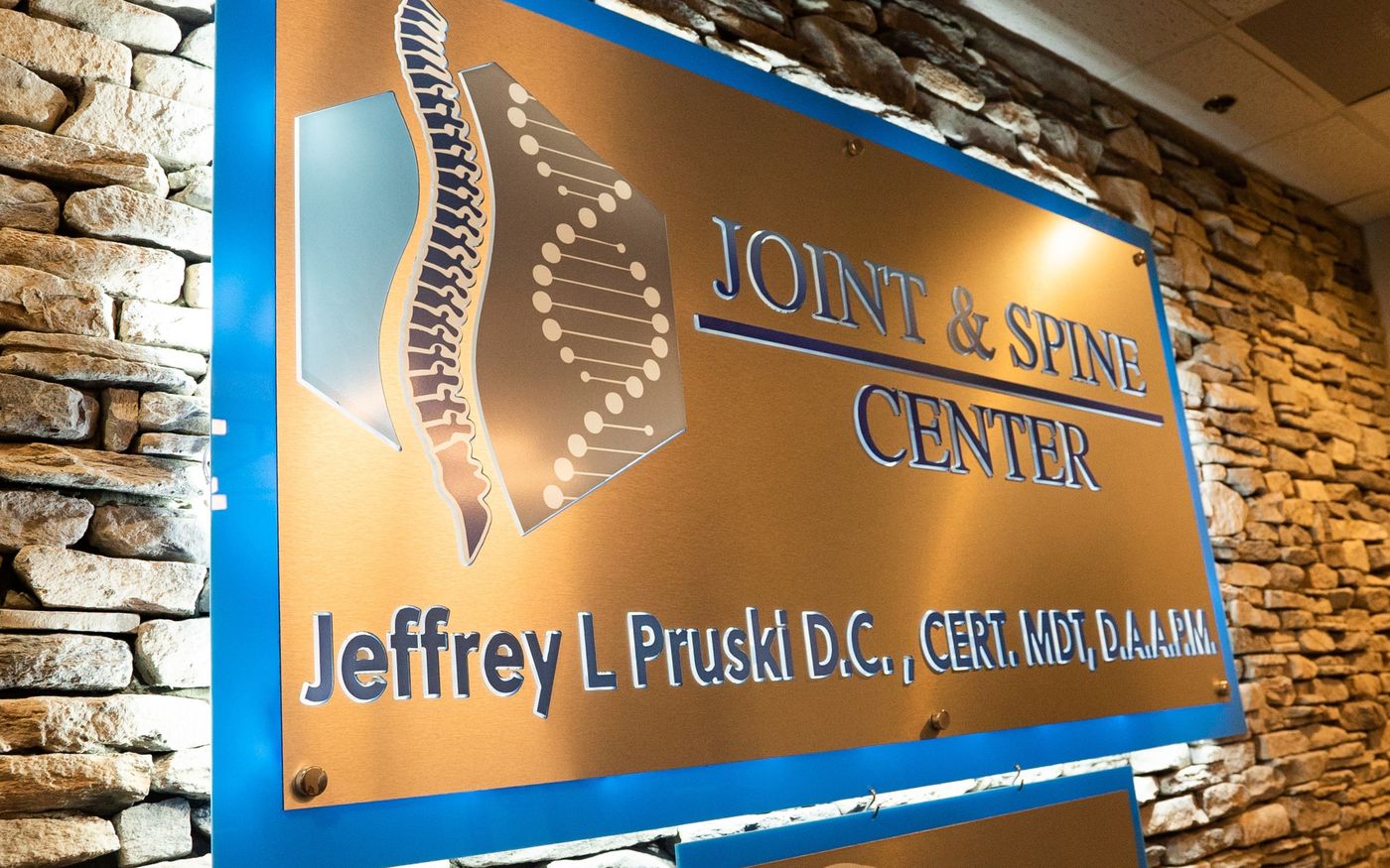 Joint & Spine Center signage at the practice's Huntsville, TX office