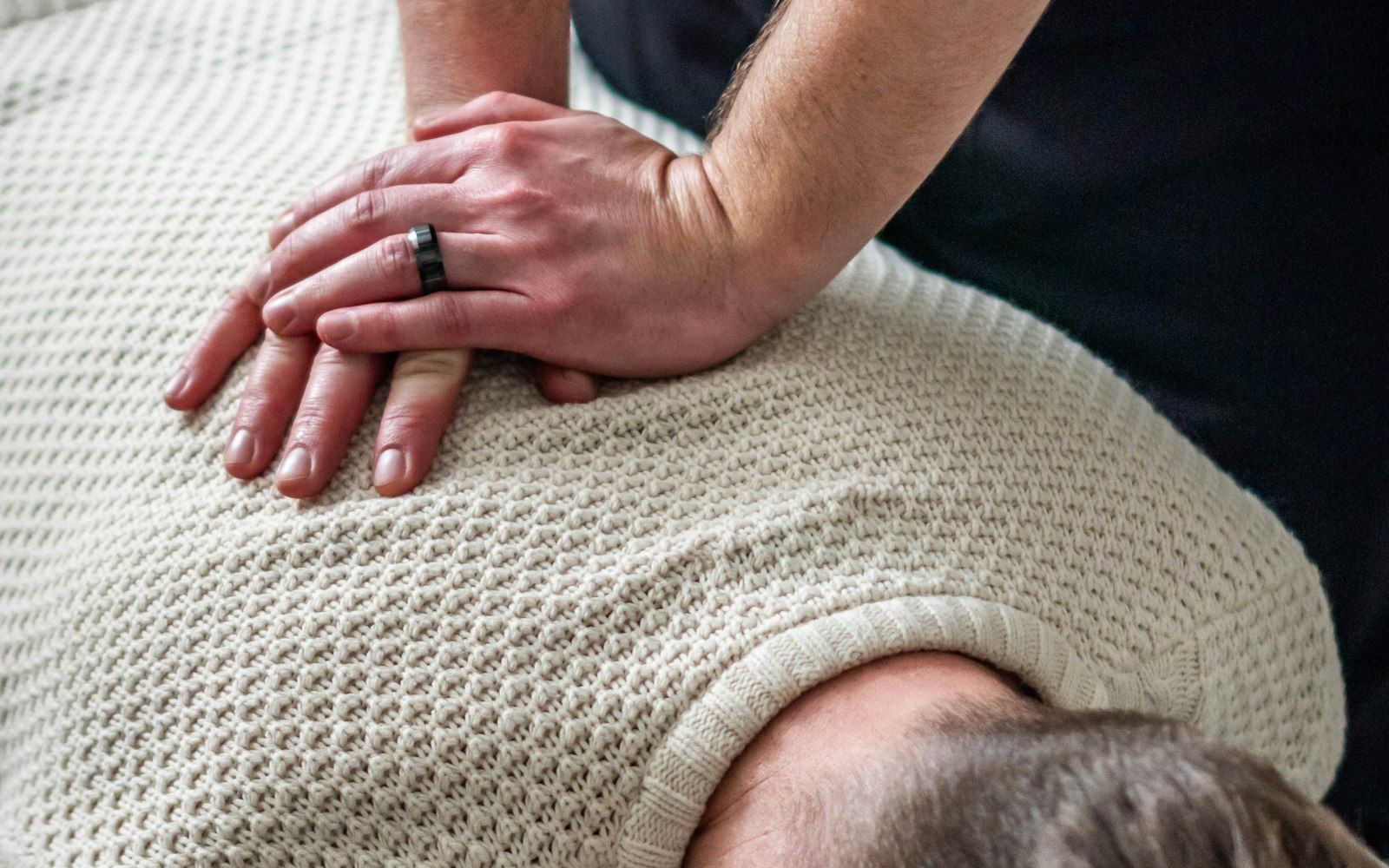 A hands-on chiropractic spinal adjustment